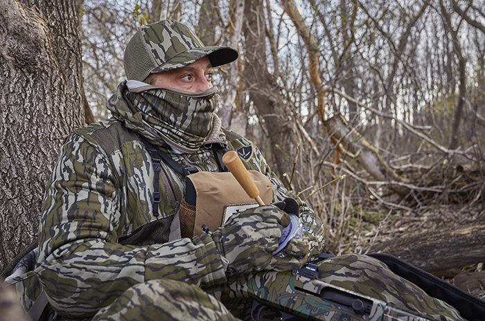 greg dressed in full camouflage gear while he is turkey hunting
